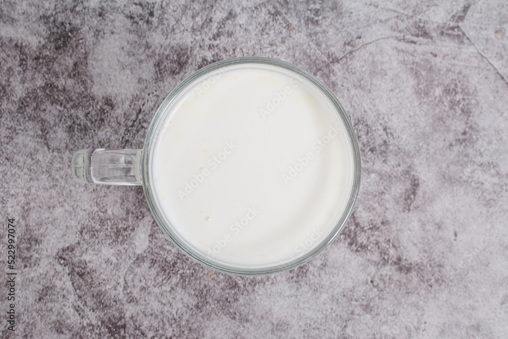 top view beverage liquid milk white fresh natural in a glass bottle on table drink to healthy has protein and calcium for child or toddler, nobody, closeup, cement background and copy space top view beverage liquid milk white fresh natural in a glass bottle on table drink to healthy has protein and calcium for child or toddler, nobody, closeup, cement background and copy space