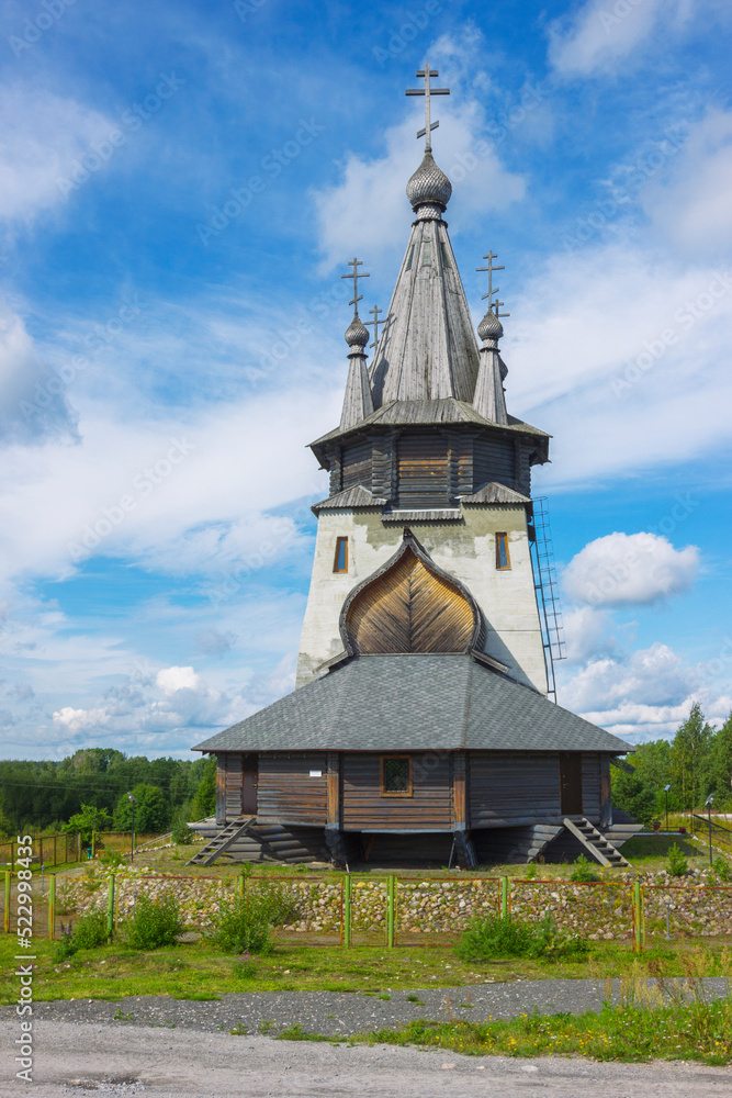 Hipped according to execution Church of St. Nicholas Wonderworker, at entrance to the village of Povenets. Karelia. Russia Hipped according to execution Church of St. Nicholas Wonderworker, at entrance to the village of Povenets. Karelia. Russia