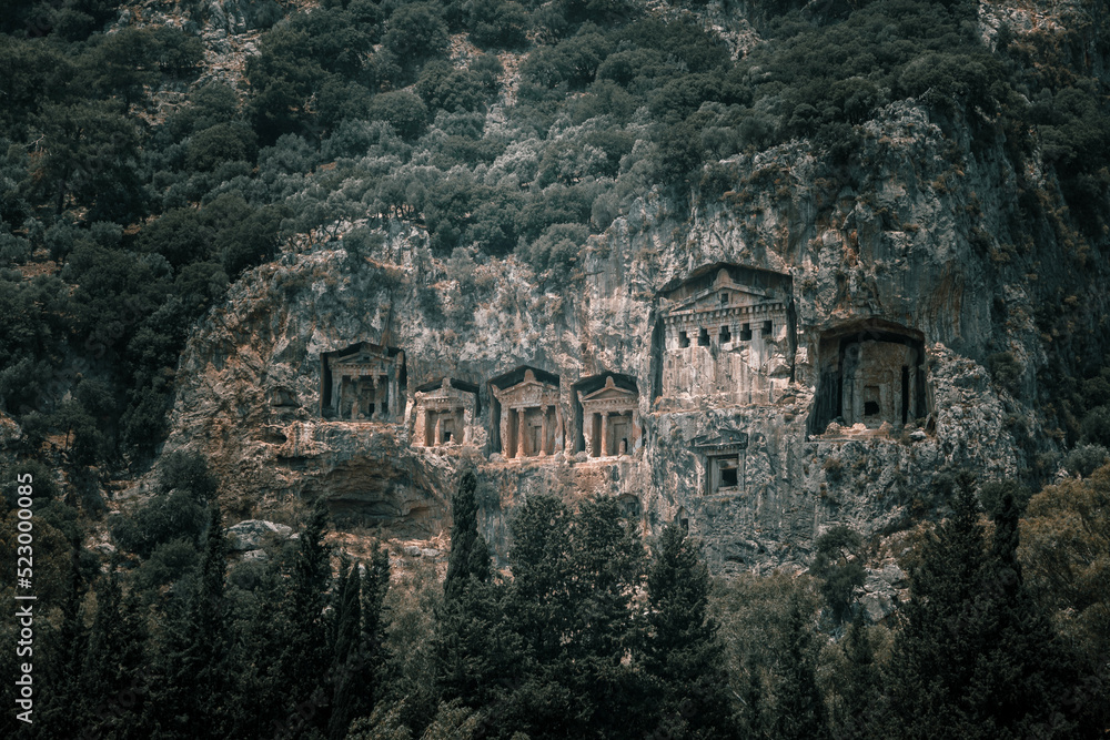 Beautiful Lycian tombs in the rock. Turkish Dalyan. Remains of an ancient civilization. Ancient architecture in the rock. Beautiful mountains. Beautiful Lycian tombs in the rock. Turkish Dalyan. Remains of an ancient civilization. Ancient architecture in the rock. Beautiful mountains.