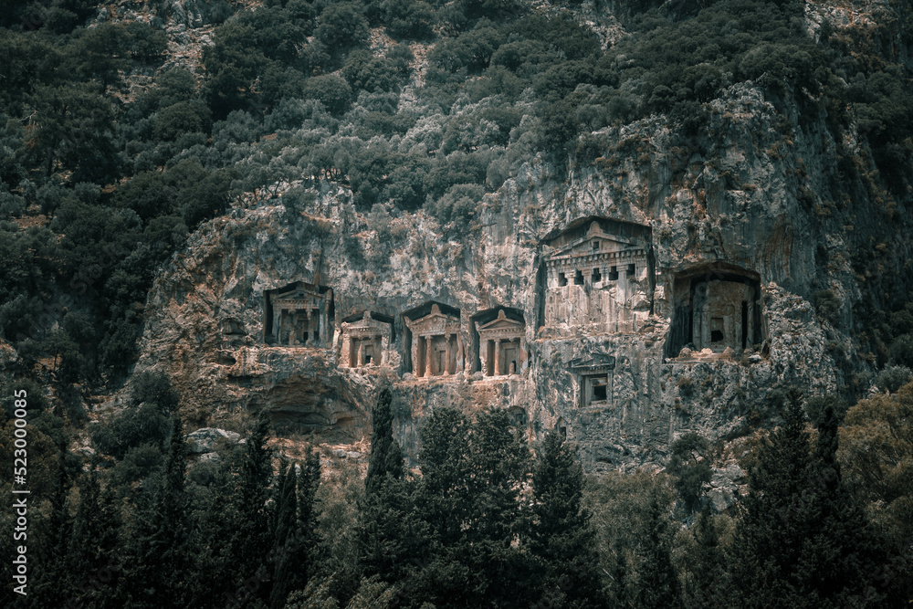 Beautiful Lycian tombs in the rock. Turkish Dalyan. Remains of an ancient civilization. Ancient architecture in the rock. Beautiful mountains.