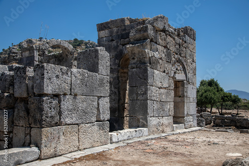 Beautiful ancient stone city. Ruined old antique abandoned city. Ancient ancient city. Stone walls. Historical place. Sunny summer day.