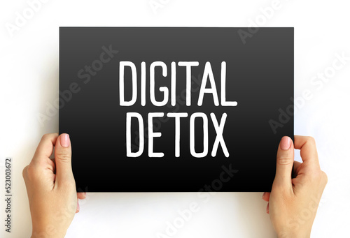 Digital Detox - period of time when a person voluntarily refrains from using digital devices, text concept on card