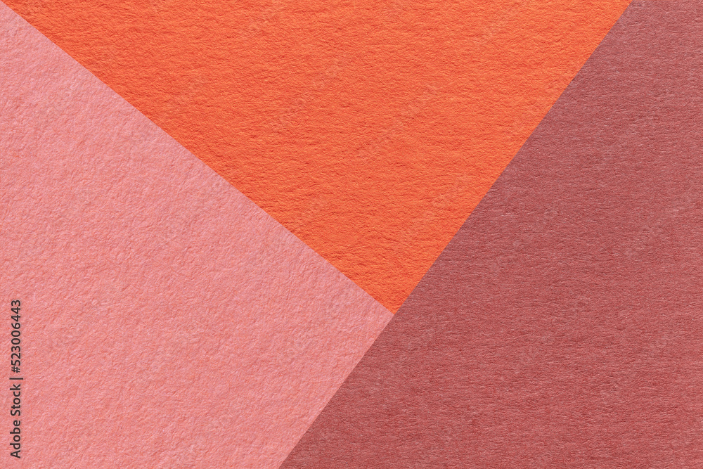 Texture of craft red, pink and orange shade color paper background, macro. Structure of vintage abstract rose cardboard Texture of craft red, pink and orange shade color paper background, macro. Structure of vintage abstract rose cardboard