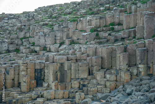 Honeycomb columns of the Giant's Causeway natural wonder located in County Antrim on the north coast of Northern Ireland, UK