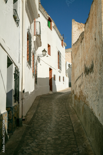 View of the desolated street with typical Spanish houses in Alcalá del Júcar, Albacete, Spain