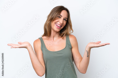 Young caucasian woman isolated on white background with shocked facial expression