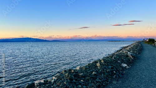 complete calm no wind no waves on pacific ocean looks like a lake on Vancouver island blue water silence calm tranquility and peace great place to relax background Parksville beach Surfside RV resort