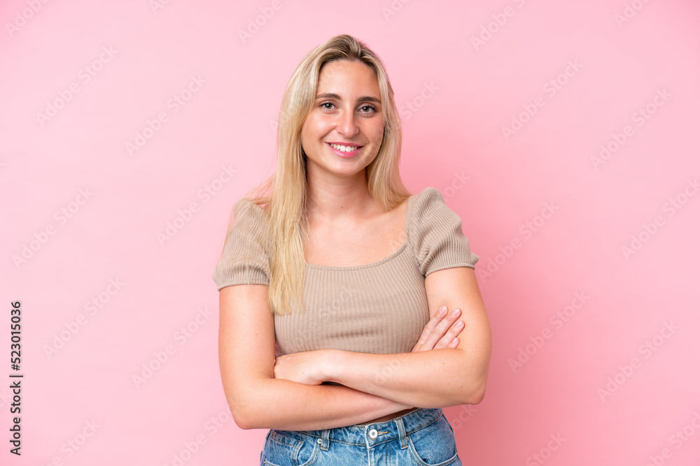 Young caucasian woman isolated on pink background keeping the arms crossed in frontal position Young caucasian woman isolated on pink background keeping the arms crossed in frontal position