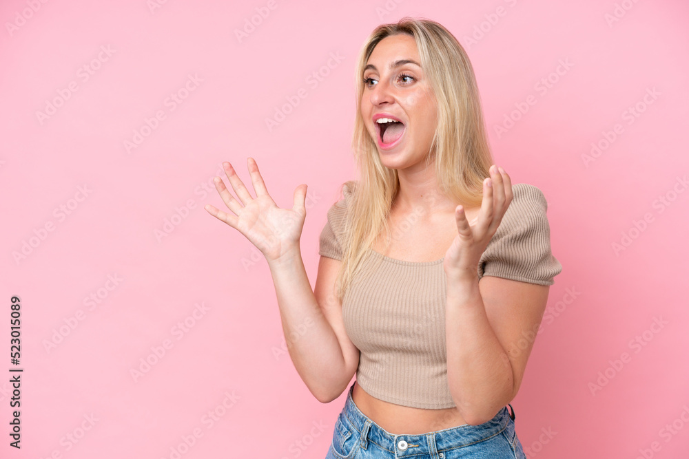 Young caucasian woman isolated on pink background with surprise facial expression Young caucasian woman isolated on pink background with surprise facial expression