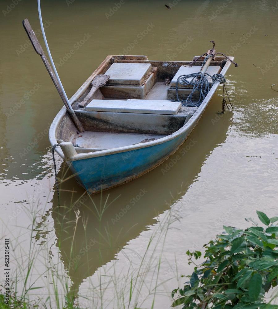 Obraz premium traditional fishing boat on the river
