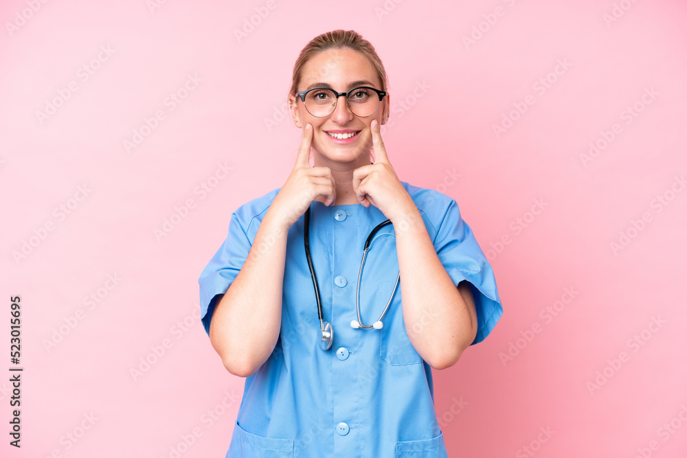 Young surgeon nurse woman isolated on pink background smiling with a happy and pleasant expression Young surgeon nurse woman isolated on pink background smiling with a happy and pleasant expression