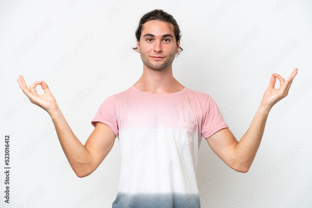 Caucasian handsome man isolated on white background in zen pose Caucasian handsome man isolated on white background in zen pose