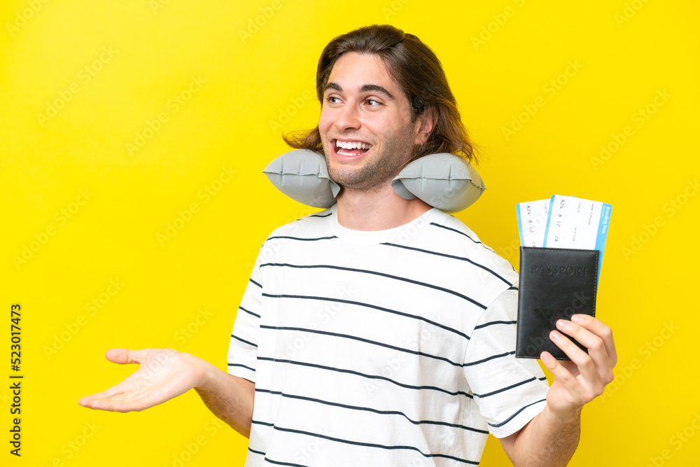 handsome Man with Inflatable Travel Pillow with surprise expression while looking side handsome Man with Inflatable Travel Pillow with surprise expression while looking side