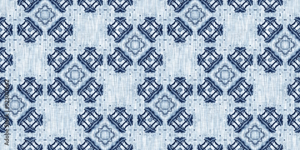 Fototapeta premium Indigo dye wash coastal damask seamless border pattern. Washed out geometric dip dyed blur effect edging. Nautical and marine ocean blue masculine endless tape background with linen texture trim.
