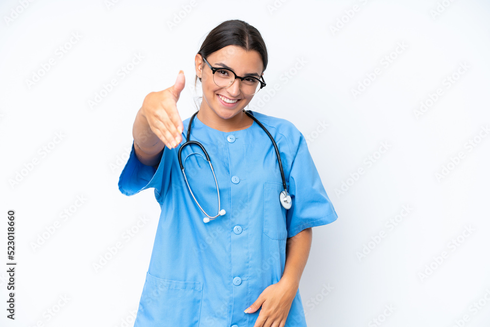 Young nurse woman isolated on white background shaking hands for closing a good deal Young nurse woman isolated on white background shaking hands for closing a good deal