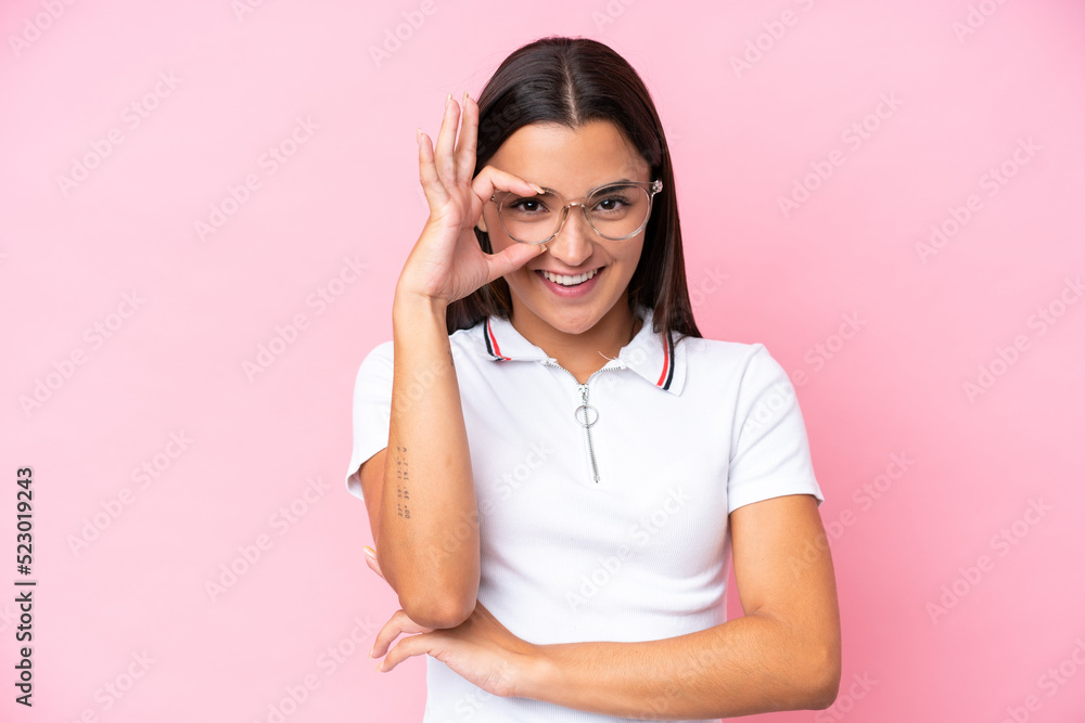 Young caucasian woman isolated on pink background With glasses with happy expression Young caucasian woman isolated on pink background With glasses with happy expression
