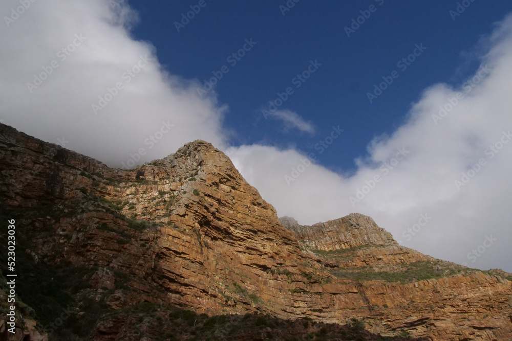 White clouds rolling over the mountain tops at Chapmans Peak, Western Cape
