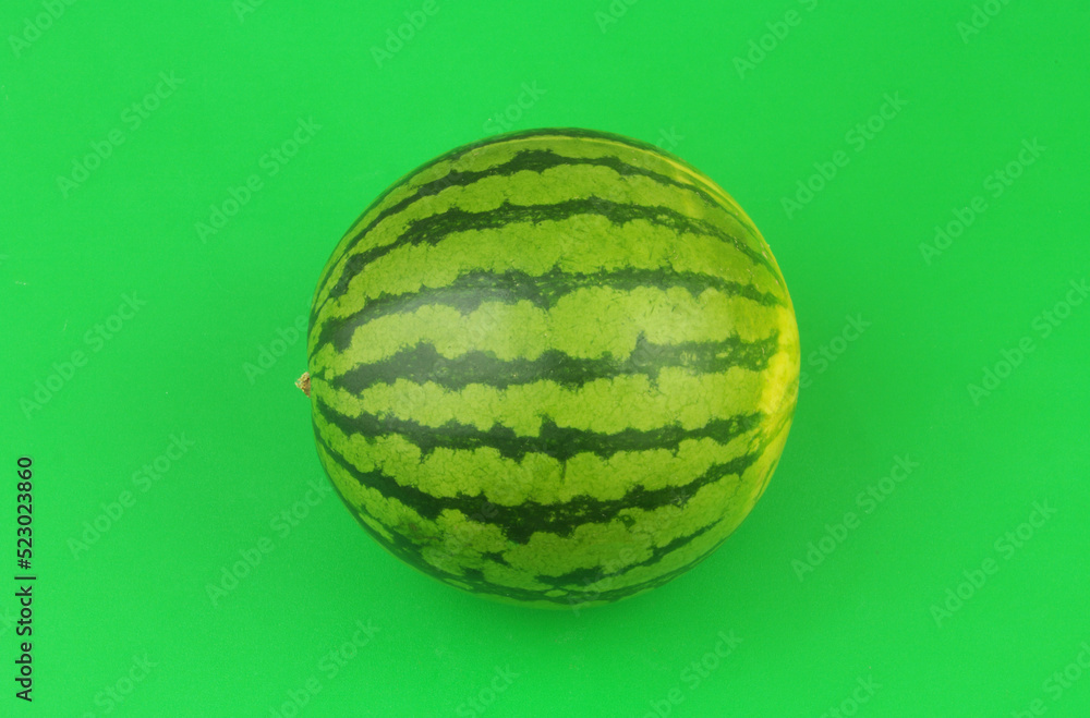 Watermelon on green background close up. Watermelon on green background close up.