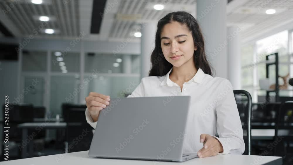 Young tired woman office worker working on laptop typing report finishes work calm balanced female manager meditates with closed eyes resting at workplace improves mental health relaxes practices yoga Young tired woman office worker working on laptop typing report finishes work calm balanced female manager meditates with closed eyes resting at workplace improves mental health relaxes practices yoga