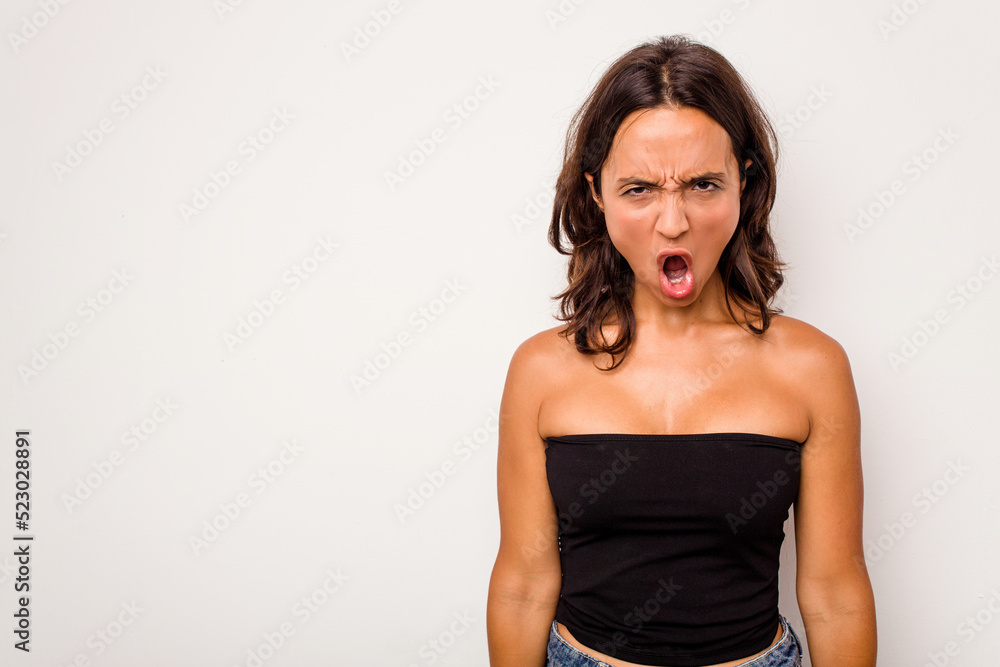 Young hispanic woman isolated on white background shouting very angry, rage concept, frustrated. Young hispanic woman isolated on white background shouting very angry, rage concept, frustrated.