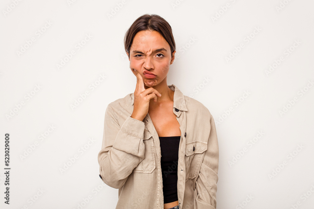 Young hispanic woman isolated on white background having a strong teeth pain, molar ache. Young hispanic woman isolated on white background having a strong teeth pain, molar ache.