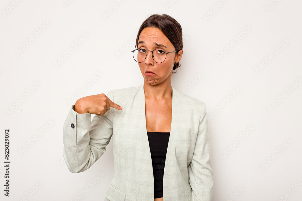 Young hispanic woman isolated on white background person pointing by hand to a shirt copy space, proud and confident Young hispanic woman isolated on white background person pointing by hand to a shirt copy space, proud and confident