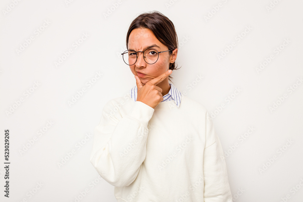 Young hispanic woman isolated on white background contemplating, planning a strategy, thinking about the way of a business.