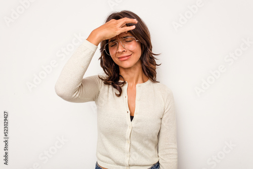 Young hispanic woman isolated on white background touching temples and having headache.