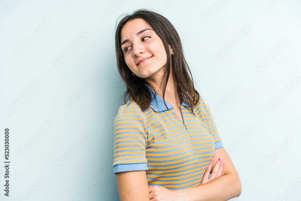 Young caucasian woman isolated on blue background laughing and having fun. Young caucasian woman isolated on blue background laughing and having fun.