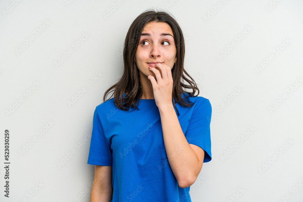 Young caucasian woman isolated on white background biting fingernails, nervous and very anxious. Young caucasian woman isolated on white background biting fingernails, nervous and very anxious.
