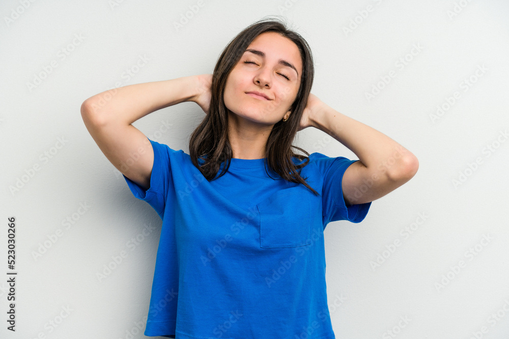 Young caucasian woman isolated on white background feeling confident, with hands behind the head. Young caucasian woman isolated on white background feeling confident, with hands behind the head.