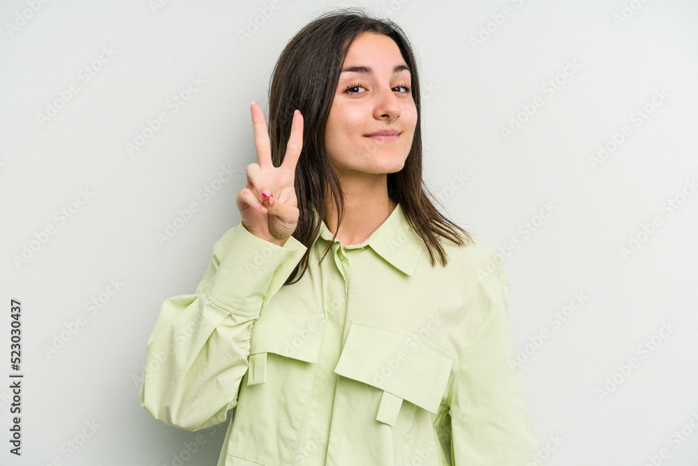 Young caucasian woman isolated on white background showing number two with fingers. Young caucasian woman isolated on white background showing number two with fingers.