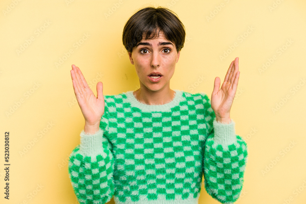 Young caucasian woman with a short hair cut isolated surprised and shocked. Young caucasian woman with a short hair cut isolated surprised and shocked.