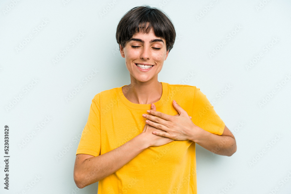 Young caucasian woman with a short hair cut isolated has friendly expression, pressing palm to chest. Love concept. Young caucasian woman with a short hair cut isolated has friendly expression, pressing palm to chest. Love concept.