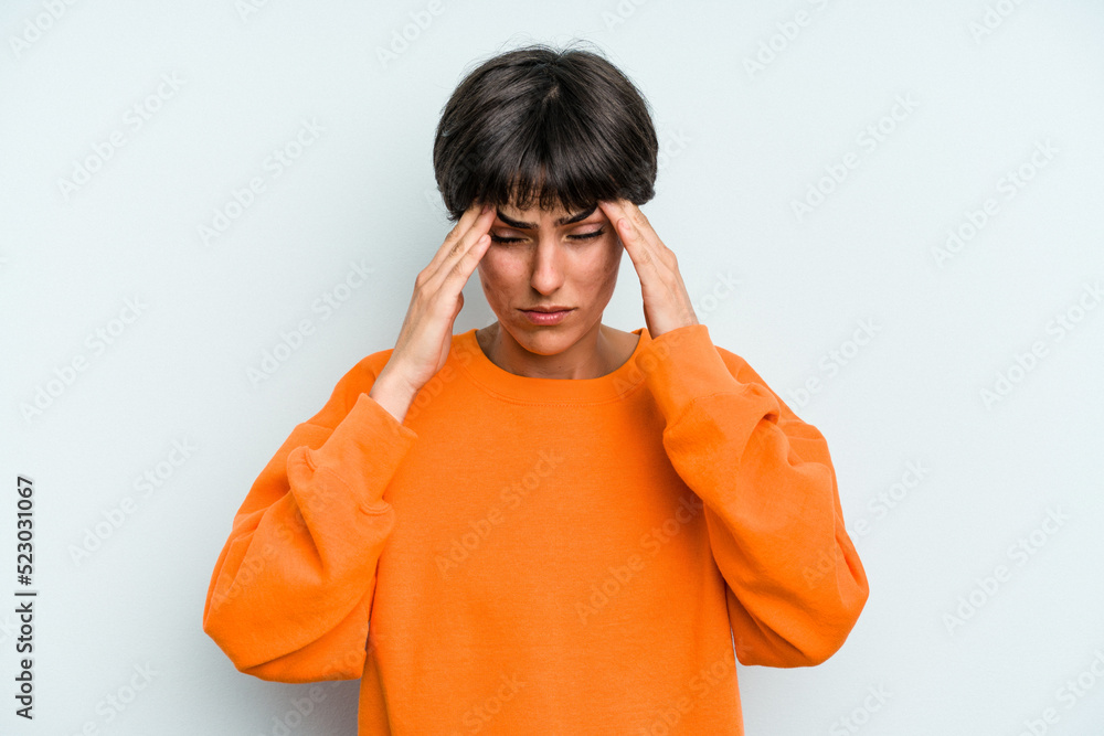 Young caucasian woman with a short hair cut isolated having a head ache, touching front of the face. Young caucasian woman with a short hair cut isolated having a head ache, touching front of the face.