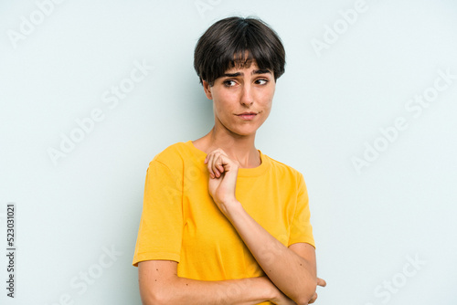 Young caucasian woman with a short hair cut isolated confused, feels doubtful and unsure.