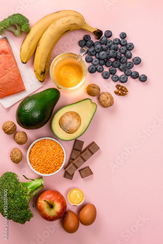 Best foods for brain and memory on pink background. Food for mind and charge of energy. Healthy lifestyle. Copy space. Top view