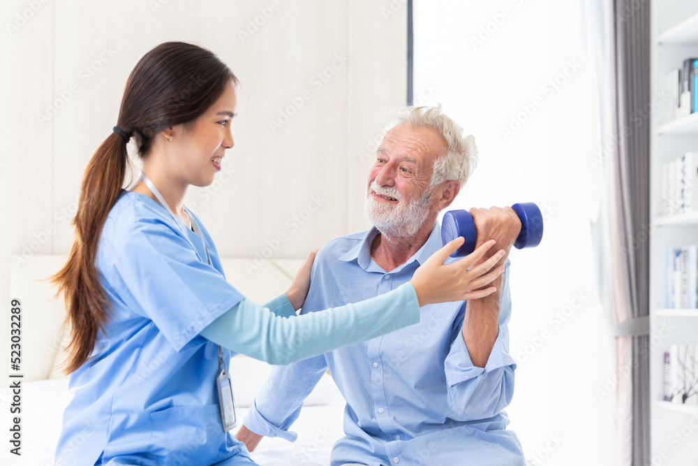 Fototapeta premium happy senior male patient health check and takecare by young female doctor or nurse at home after retirement for good health