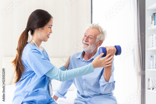happy senior male patient health check and takecare by young female doctor or nurse at home after retirement for good health