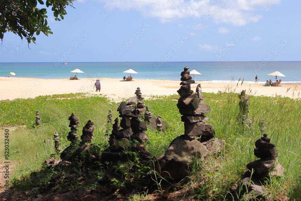 Rock cairn at trail to Bode beach at Fernando de Noronha island, Brazil.