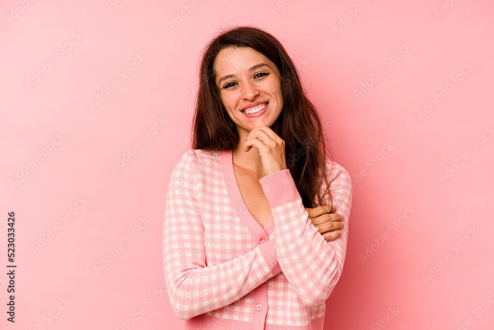 Young caucasian woman isolated on pink background smiling happy and confident, touching chin with hand. Young caucasian woman isolated on pink background smiling happy and confident, touching chin with hand.