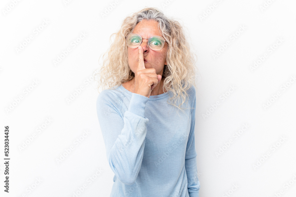 Middle age caucasian woman isolated on white background keeping a secret or asking for silence. Middle age caucasian woman isolated on white background keeping a secret or asking for silence.