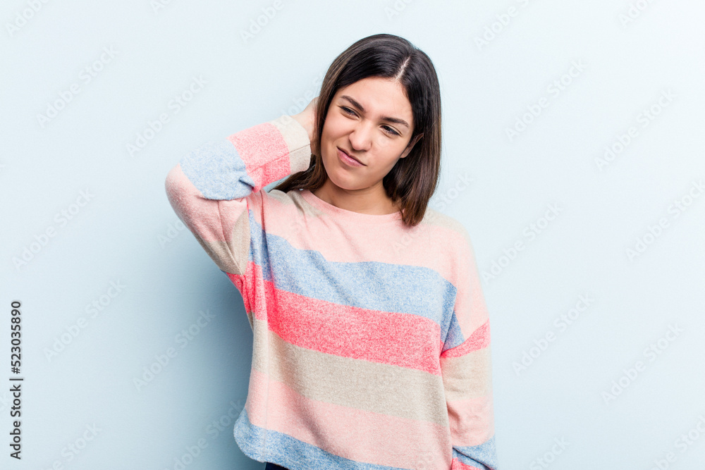 Young caucasian woman isolated on blue background tired and very sleepy keeping hand on head. Young caucasian woman isolated on blue background tired and very sleepy keeping hand on head.