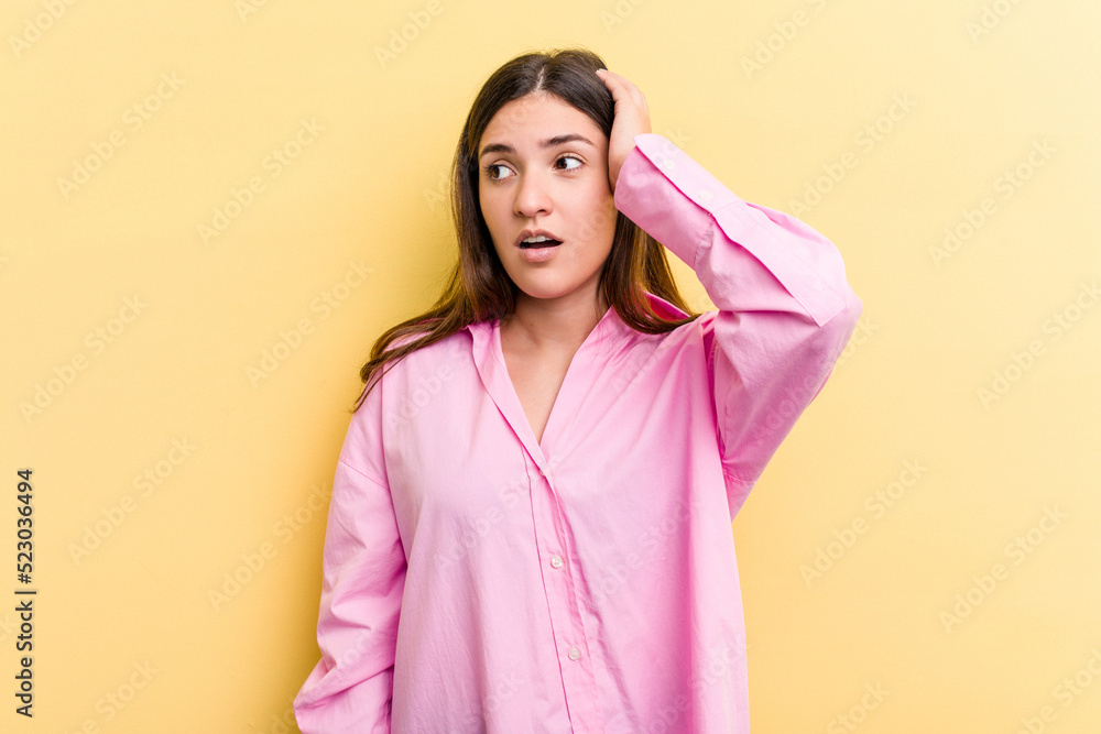 Young caucasian woman isolated on yellow background being shocked, she has remembered important meeting. Young caucasian woman isolated on yellow background being shocked, she has remembered important meeting.