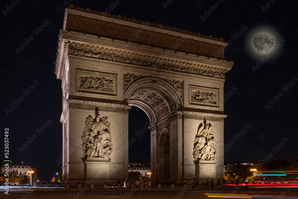 Paris, France - 08 12 2022: Place Charles de Gaulle. L'Arc de Triomphe with the super moon by night