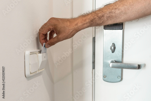 Canvas Print Unrecognizable person using a hotel key card on vacation