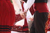 People in traditional folk costume of The National Folklore Fair in Koprivshtica. The National Folklore Fair in Koprivshtica is entered in the UNESCO Register of the human intangible cultural heritage