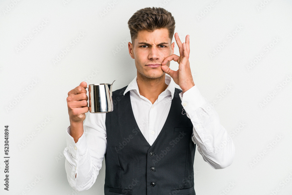 Young caucasian barista man isolated on yellow background with fingers on lips keeping a secret. Young caucasian barista man isolated on yellow background with fingers on lips keeping a secret.
