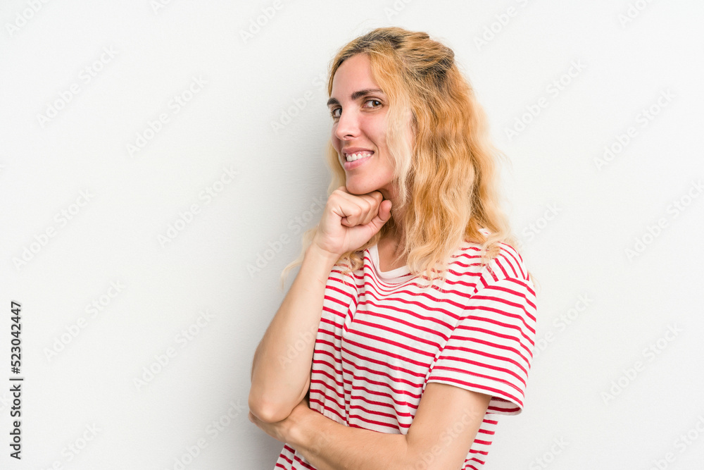 Young caucasian woman isolated on white background smiling happy and confident, touching chin with hand. Young caucasian woman isolated on white background smiling happy and confident, touching chin with hand.