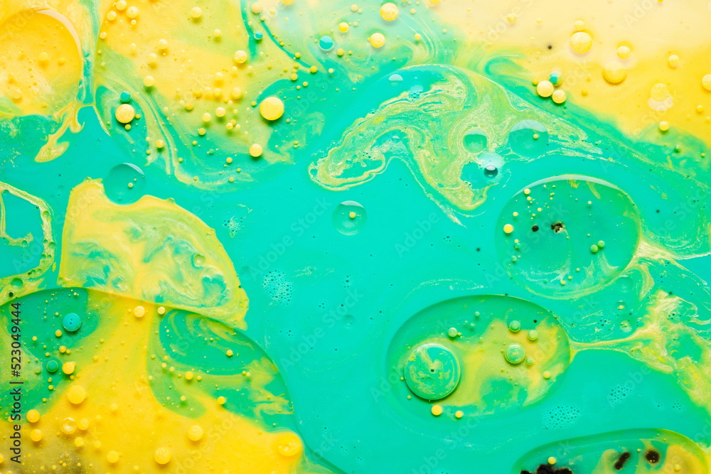 Alcohol ink green yellow abstract background, natural texture bubbles paint splatter on water Alcohol ink green yellow abstract background, natural texture bubbles paint splatter on water